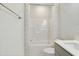 This bathroom showcases a pristine shower-tub combination, a toilet, and a modern vanity area at 713 Ramsours Mill Dr, Holly Springs, NC 27540