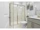 Bathroom with a glass-enclosed shower, vanity, and marble flooring at 713 Ramsours Mill Dr, Holly Springs, NC 27540