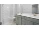 This bathroom features a double vanity, a large mirror, and modern fixtures at 713 Ramsours Mill Dr, Holly Springs, NC 27540