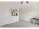 Light and airy bedroom showcasing neutral walls and carpet, and a ceiling fan at 713 Ramsours Mill Dr, Holly Springs, NC 27540