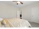 This bedroom features a neutral color palette and plush carpeting for a cozy and inviting atmosphere at 713 Ramsours Mill Dr, Holly Springs, NC 27540