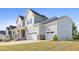 Spacious home featuring a two-car garage and a well-maintained lawn, offering both convenience and beauty at 713 Ramsours Mill Dr, Holly Springs, NC 27540