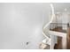 A bright hallway featuring a modern chandelier, neutral walls and a view to the living room below at 713 Ramsours Mill Dr, Holly Springs, NC 27540