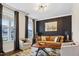 Stylish living room with chic decor, plush seating, and ample natural light, perfect for relaxing and entertaining at 713 Ramsours Mill Dr, Holly Springs, NC 27540