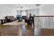 Spacious living room with hardwood floors, leather furniture, and a decorative area rug at 713 Ramsours Mill Dr, Holly Springs, NC 27540