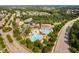 Aerial view of the community pool area with ample seating, playground, and lush landscaping at 728 Peninsula Forest Pl, Cary, NC 27519