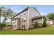Backyard features a well-maintained lawn, multiple windows, and a deck for outdoor enjoyment at 728 Peninsula Forest Pl, Cary, NC 27519