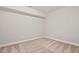 A basement space with neutral walls, carpet floors, and a white beam at 728 Peninsula Forest Pl, Cary, NC 27519