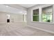 Spacious basement with neutral walls, carpet floors, large windows, and a an attached bathroom at 728 Peninsula Forest Pl, Cary, NC 27519