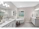 Bright bathroom features dual vanities, modern tub, and stylish decor at 728 Peninsula Forest Pl, Cary, NC 27519
