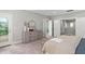 Spacious bedroom with view to deck, featuring a closet and neutral decor at 728 Peninsula Forest Pl, Cary, NC 27519