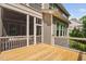 Beautiful outdoor deck area with screened porch and railing, perfect for relaxing and entertaining at 728 Peninsula Forest Pl, Cary, NC 27519