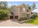Charming side view showcasing the home's architectural details and attached three-car garage at 728 Peninsula Forest Pl, Cary, NC 27519