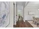 Inviting home hallway showcasing hardwood floors, crown molding, and elegant wainscoting at 728 Peninsula Forest Pl, Cary, NC 27519