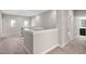 Open hallway showcasing neutral tones, carpet, and natural light at 728 Peninsula Forest Pl, Cary, NC 27519