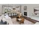 Open floor plan living room with kitchen view at 728 Peninsula Forest Pl, Cary, NC 27519