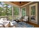 Relaxing screened-in porch with comfortable outdoor seating at 728 Peninsula Forest Pl, Cary, NC 27519