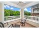 Serene condo balcony with comfortable seating and a scenic view of the surrounding greenery at 734 Portstewart Dr, Cary, NC 27519