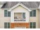 A close-up of a condo balcony with chairs that offers a cozy outdoor retreat at 734 Portstewart Dr, Cary, NC 27519