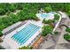 Aerial view of the community pool area featuring a lap pool, leisure pool, and plenty of seating at 734 Portstewart Dr, Cary, NC 27519