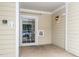 Building entryway with a glass door, mailboxes, and neutral siding, providing secure access at 734 Portstewart Dr, Cary, NC 27519