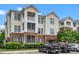 Attractive condo building featuring a blend of brick and siding, multiple balconies, and convenient parking at 734 Portstewart Dr, Cary, NC 27519