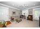 Inviting living room with plush seating, a ceiling fan, and access to an outdoor balcony at 734 Portstewart Dr, Cary, NC 27519