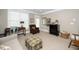 Well-lit living room with neutral colors, crown molding, and multiple windows for abundant natural light at 734 Portstewart Dr, Cary, NC 27519