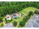 Aerial view of community playground, soccer field, parking, and covered picnic area surrounded by lush trees at 734 Portstewart Dr, Cary, NC 27519