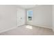 Cozy bedroom with neutral carpet and a window with a view of the outdoors at 74 W Emily Gardens Dr, Selma, NC 27576