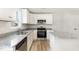 Stylish kitchen features white cabinetry, stainless steel appliances, and granite countertops at 74 W Emily Gardens Dr, Selma, NC 27576