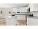Bright kitchen with white cabinets, granite countertops, stainless steel appliances, and a center island at 74 W Emily Gardens Dr, Selma, NC 27576