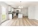 Contemporary kitchen features stainless steel appliances, white cabinets, and a functional center island at 74 W Emily Gardens Dr, Selma, NC 27576
