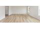 Spacious living area showcases beautiful floors, neutral paint, and ample natural light from the window at 74 W Emily Gardens Dr, Selma, NC 27576