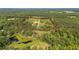 Beautiful property with an established home site, wooded area and pond; property line is highlighted in red at 7620 Sam Hall Rd, Oxford, NC 27565
