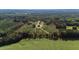 Beautiful lot with an established home site, long driveway and surrounding landscape; property line is highlighted in red at 7620 Sam Hall Rd, Oxford, NC 27565