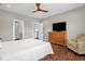 Bedroom with hardwood floors and a paisley chair at 7620 Sam Hall Rd, Oxford, NC 27565
