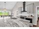 Modern kitchen featuring gray cabinets, granite countertops, stainless steel appliances and pendant lighting at 7620 Sam Hall Rd, Oxford, NC 27565