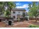 Well-maintained backyard with a deck, patio, BBQ grill, and beautiful landscaping at 7917 Featherstone Dr, Raleigh, NC 27615