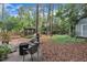 Spacious backyard featuring a gazebo, grill, and seating area, ideal for outdoor gatherings and relaxation at 7917 Featherstone Dr, Raleigh, NC 27615