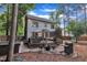 Expansive backyard with a deck, patio, grill, and mature trees for privacy at 7917 Featherstone Dr, Raleigh, NC 27615