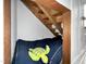 Cozy basement nook with a comfortable bed and a playful turtle decoration at 7917 Featherstone Dr, Raleigh, NC 27615