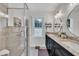 Stylish bathroom with a glass-enclosed shower, double sink vanity, and modern fixtures at 7917 Featherstone Dr, Raleigh, NC 27615