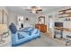 Spacious bedroom with a large window, wooden dresser, ceiling fan and a comfortable bed with blue quilt at 7917 Featherstone Dr, Raleigh, NC 27615