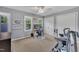 Bright bedroom setup as a home office with windows, white trim, and ample space at 7917 Featherstone Dr, Raleigh, NC 27615
