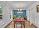 Dining room with hardwood floors, natural light, and stylish furnishings perfect for Gathering gatherings at 7917 Featherstone Dr, Raleigh, NC 27615