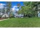 Well-kept two-story home with a lush lawn and mature trees in a desirable neighborhood at 7917 Featherstone Dr, Raleigh, NC 27615