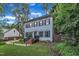 Charming two-story home with a well-maintained lawn, brick stairs, and a classic front door at 7917 Featherstone Dr, Raleigh, NC 27615