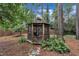 Gazebo featuring seating, lush greenery, and ample space, creating a serene outdoor retreat at 7917 Featherstone Dr, Raleigh, NC 27615