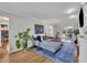 Cozy living room with modern furniture, large area rug, and a slider to the backyard at 7917 Featherstone Dr, Raleigh, NC 27615